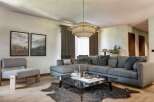 Step into luxury with this stunning living room, featuring a spacious sectional sofa perfect for entertaining.