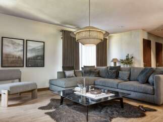 Step into luxury with this stunning living room, featuring a spacious sectional sofa perfect for entertaining.