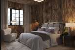 Experience rustic elegance in this stunning bedroom featuring rich wood paneling and a cozy ambiance.