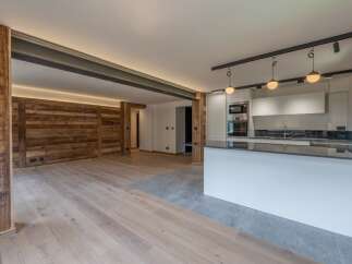 This stunning modern kitchen boasts a sleek design with high-end finishes.