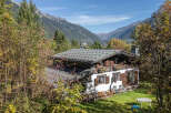 Nestled amidst the stunning mountain scenery, this charming property offers a serene retreat.
