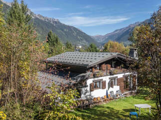 Nestled amidst the stunning mountain scenery, this charming property offers a serene retreat.