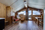 This charming chalet-style apartment offers a cozy and inviting atmosphere, perfect for a mountain getaway.