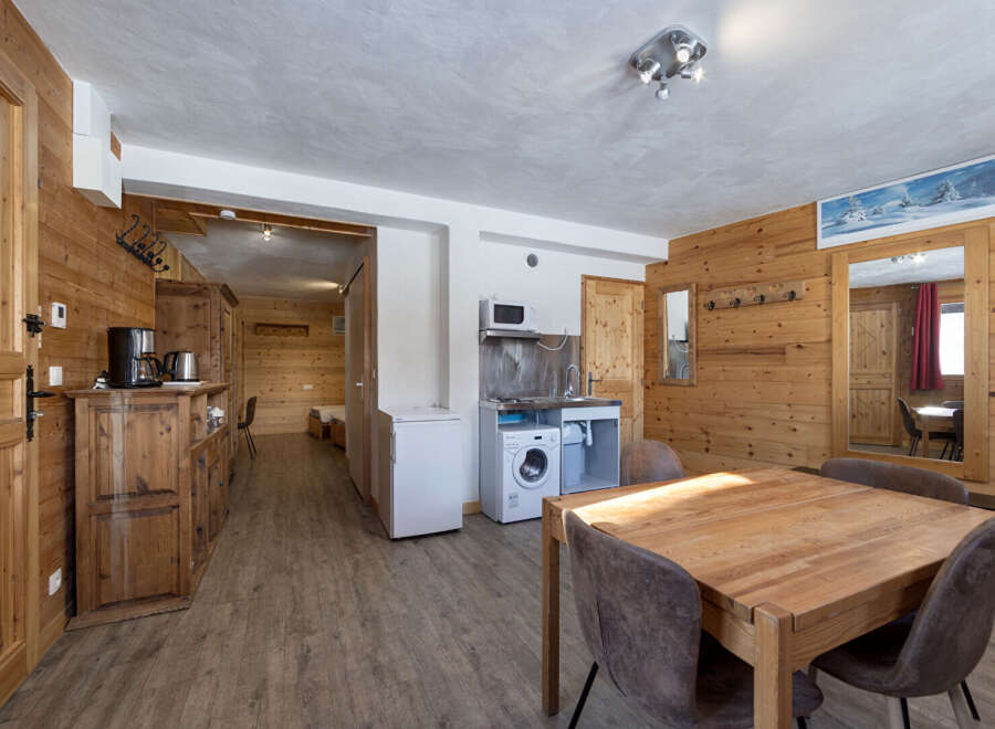 Discover the charm of this cozy apartment, featuring a warm wooden interior and a functional layout.