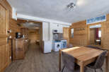 Discover the charm of this cozy apartment, featuring a warm wooden interior and a functional layout.