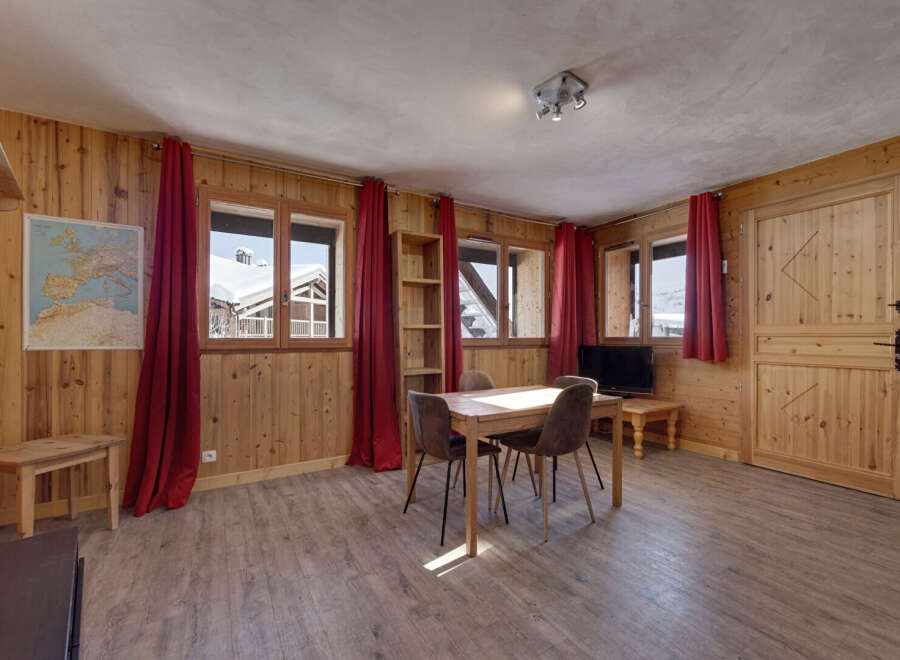 Step into this charming chalet, boasting a warm and inviting interior.