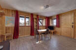 Step into this charming chalet, boasting a warm and inviting interior.