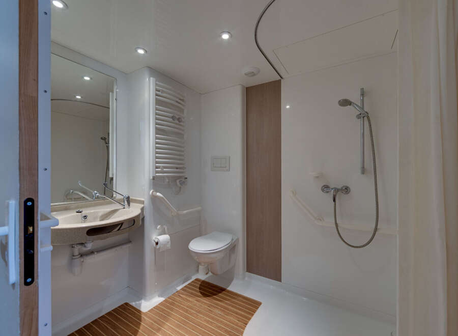 Step into this modern bathroom, designed with accessibility in mind.
