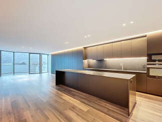 Experience modern luxury in this stunning kitchen! Featuring sleek cabinetry, a spacious island, and top-of-the-line appliances, this space is perfect for both cooking and entertaining.