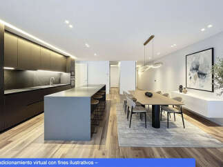 Experience modern luxury in this stunning property, featuring a sleek kitchen with a large island and high-end appliances.