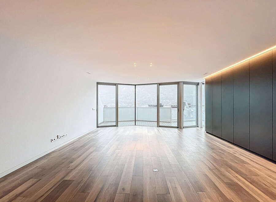 Experience luxury living in this stunning property, featuring expansive windows that flood the space with natural light.