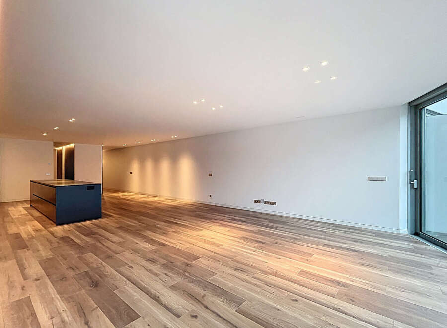 Discover modern elegance in this stunning property featuring a sleek, open-plan design.
