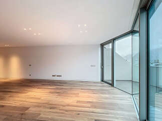 Experience modern living in this stunning property, featuring expansive windows that flood the space with natural light.