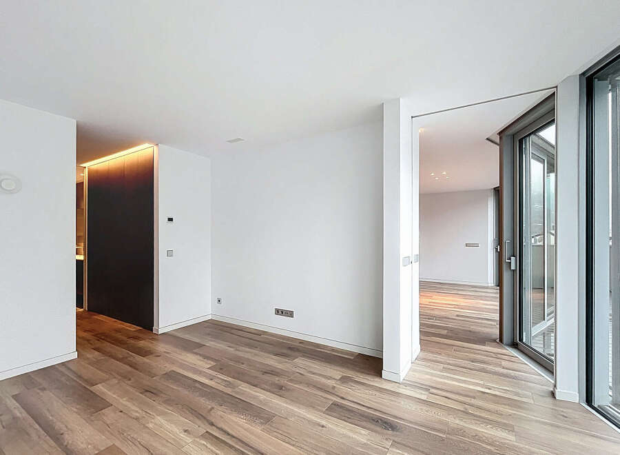 Experience modern luxury in this stunning property, featuring sleek hardwood floors and expansive windows that flood the space with natural light.