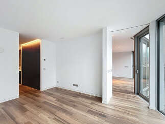 Experience modern luxury in this stunning property, featuring sleek hardwood floors and expansive windows that flood the space with natural light.
