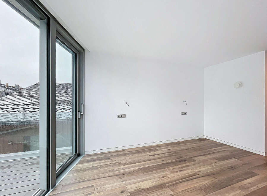 Discover the elegance of this modern property, featuring expansive windows that flood the space with natural light.