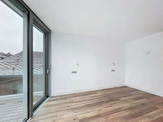 Discover the elegance of this modern property, featuring expansive windows that flood the space with natural light.