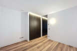 This modern interior showcases a sleek design with a focus on clean lines and minimalist aesthetics.