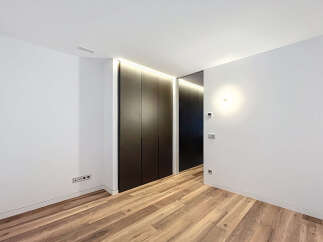 This modern interior showcases a sleek design with a focus on clean lines and minimalist aesthetics.