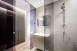 Step into modern luxury with this stunning bathroom design.