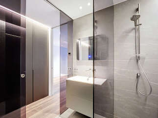 Step into modern luxury with this stunning bathroom design.