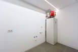 Modern utility room showcasing a sleek, white heat pump system.