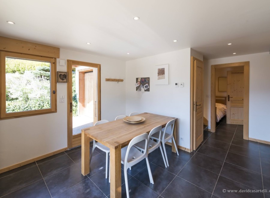 This charming chalet boasts a bright and airy dining area, perfect for enjoying meals with loved ones.