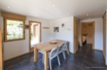 This charming chalet boasts a bright and airy dining area, perfect for enjoying meals with loved ones.