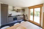This stunning kitchen boasts modern appliances and ample cabinet space, perfect for culinary enthusiasts.