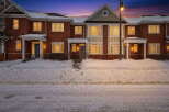 Discover this stunning townhome featuring a classic brick exterior and inviting curb appeal.