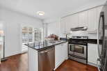 This stunning kitchen boasts modern appliances and sleek countertops, perfect for culinary enthusiasts.