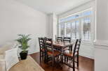 This stunning dining room boasts a warm and inviting atmosphere, perfect for hosting gatherings.