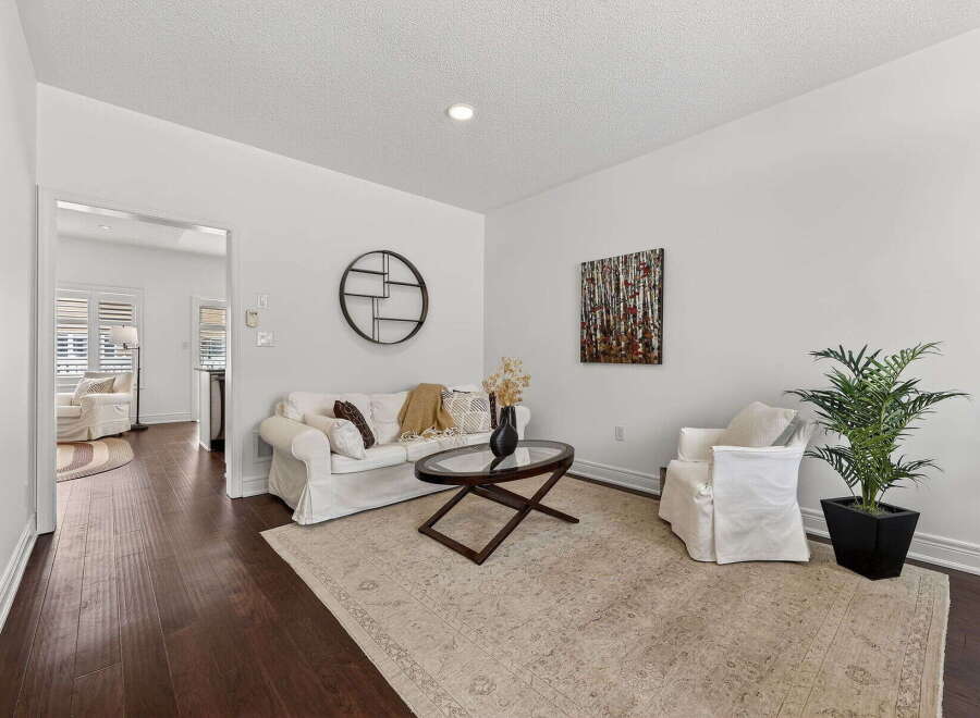Step into this inviting living space, featuring a cozy sofa and a stylish coffee table, perfect for relaxation and entertaining.