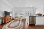 Step into this beautifully designed living space, featuring a cozy seating area and a modern kitchen.