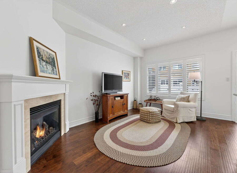 This stunning property boasts a cozy living room with a fireplace, perfect for those chilly evenings.
