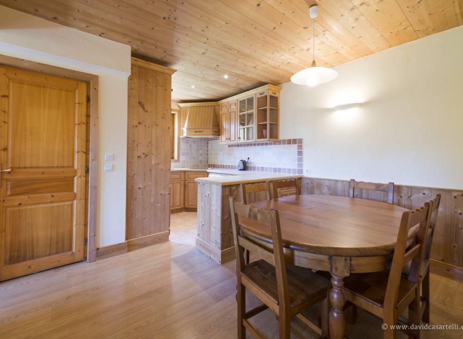 Cozy chalet kitchen and dining area with wood finishes.