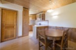 Cozy chalet kitchen and dining area with wood finishes.