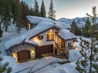 This stunning mountain home offers a perfect blend of luxury and natural beauty.
