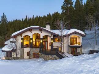 This stunning mountain home offers a luxurious retreat with its elegant design and prime location.