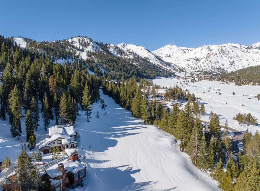 Discover a stunning mountain retreat nestled in a winter wonderland.