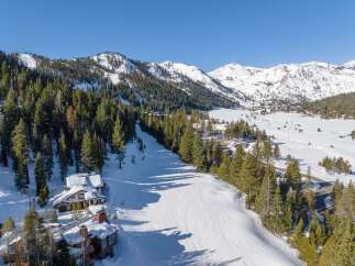 Discover a stunning mountain retreat nestled in a winter wonderland.
