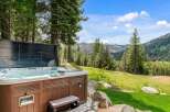 Relax and unwind in this luxurious hot tub with stunning mountain views.