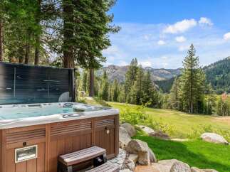 Relax and unwind in this luxurious hot tub with stunning mountain views.