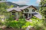 Nestled amidst lush greenery and mountain views, this stunning property offers a serene retreat.
