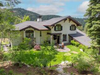 Nestled amidst lush greenery and mountain views, this stunning property offers a serene retreat.