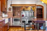 This stunning kitchen boasts high-end appliances and custom cabinetry, perfect for the discerning chef.
