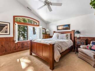 This stunning bedroom boasts a cozy and inviting atmosphere, perfect for relaxation.