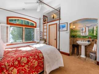Step into luxury with this stunning bedroom featuring a unique design and elegant details.