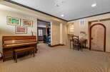 This elegant property boasts a spacious living area with a grand piano, perfect for musical enthusiasts.