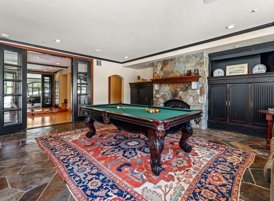 Step into luxury with this stunning property featuring a dedicated game room.